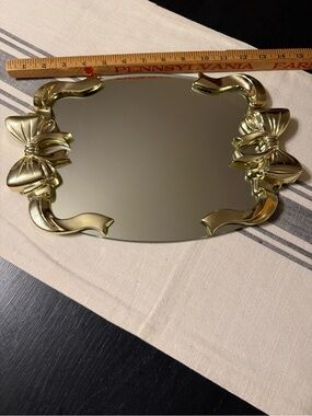 Vintage gold bow vanity mirror